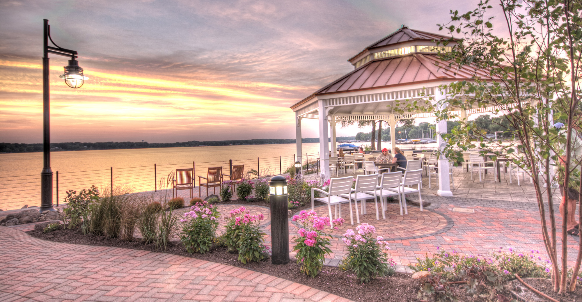 exterior patio with gazebo overlooking the river at sunset